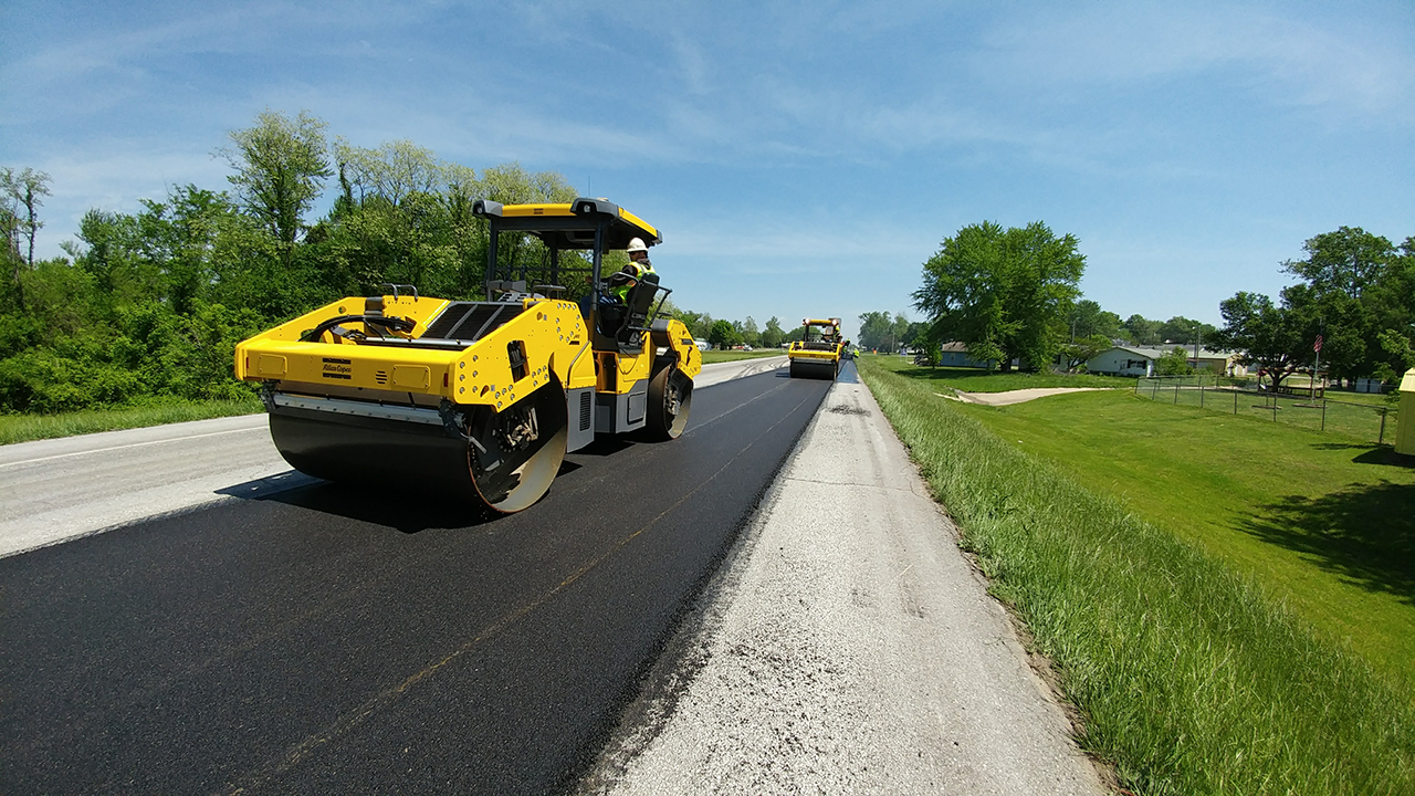 Workers operate IC rollers on Route 52 in Morgan County, Missouri